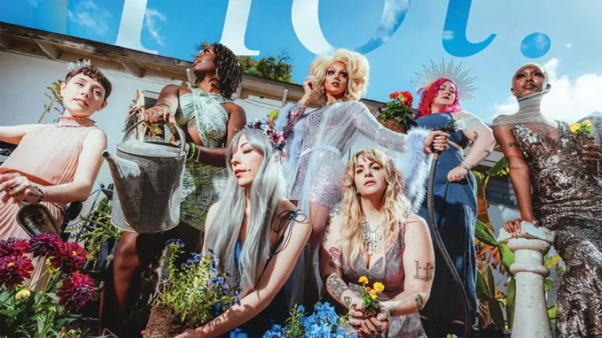 Magazine cover featuring a group of women in a garden with mulch and plants around them 