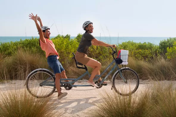 Two girls enjoy a bike ride on Sanibel Island